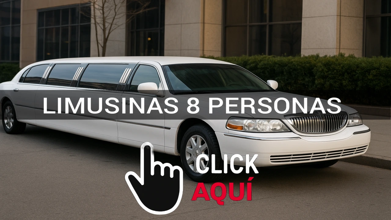 Limusina blanca de lujo para 8 personas estacionada frente a un edificio elegante, con luces encendidas y detalles cromados que resaltan su diseño sofisticado.